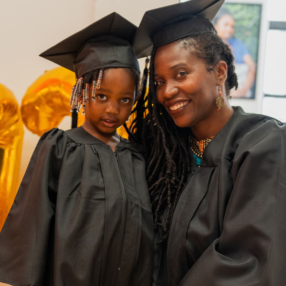 A Jeremiah Program mom and her child in graduation cap and gowns
